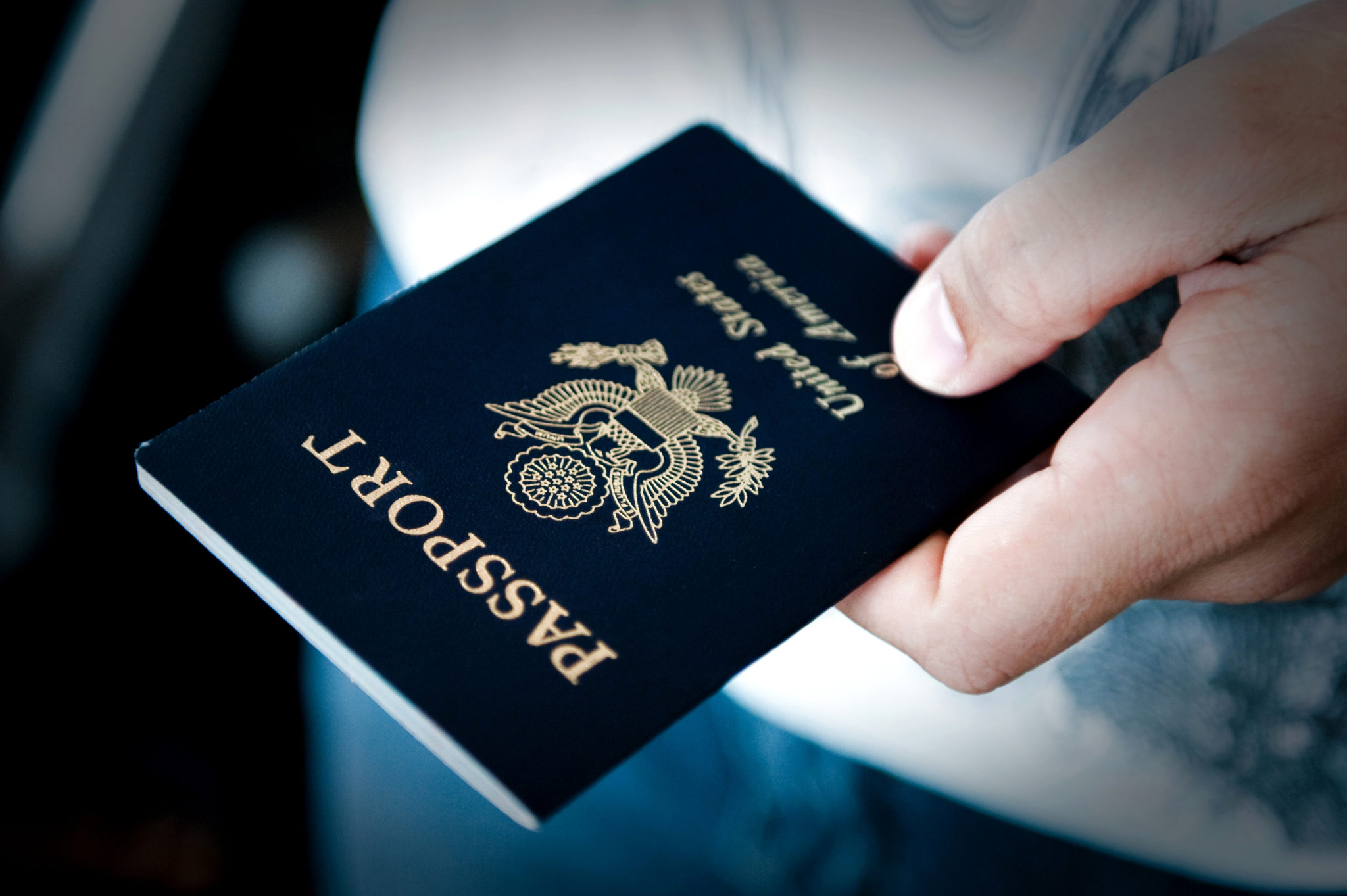 Passport in hand Image