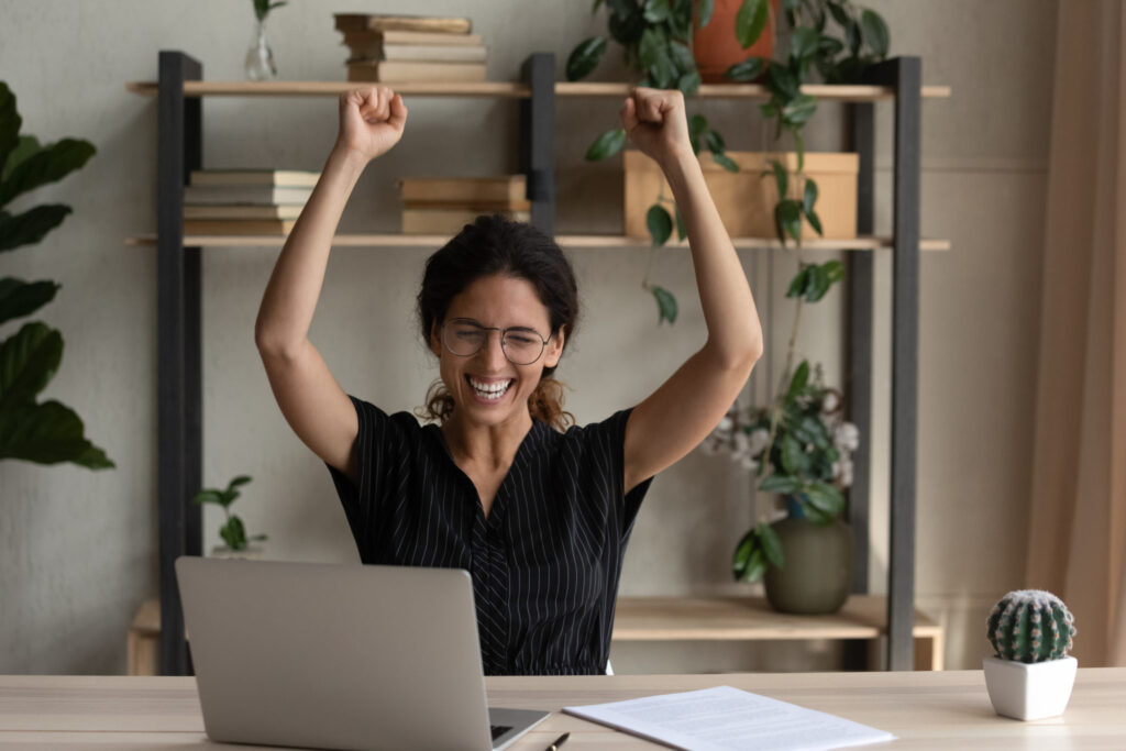 a woman with her arms up in the air